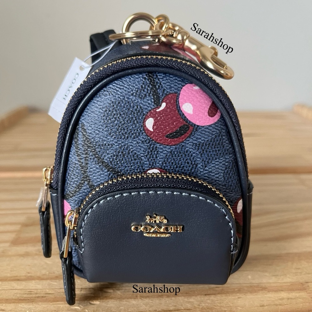 ✅Coach Mini Court Backpack Bag Charm In Signature Canvas With Cherry Print